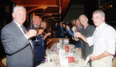 Members toast to the club’s 10th anniversary.